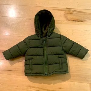 Old Navy baby puffer jacket in olive green.
